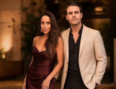 Formally dressed couple posing together at an elegant evening event