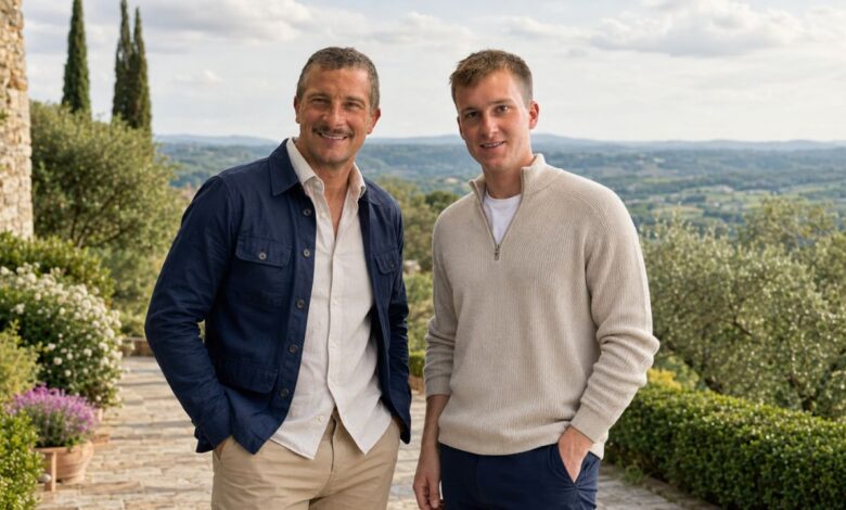 Two men standing outdoors in a countryside setting for a Jesse Grylls biography feature