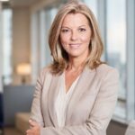 Professional female news presenter in a modern office setting for an article about Mary Nightingale illness rumours and verified health updates