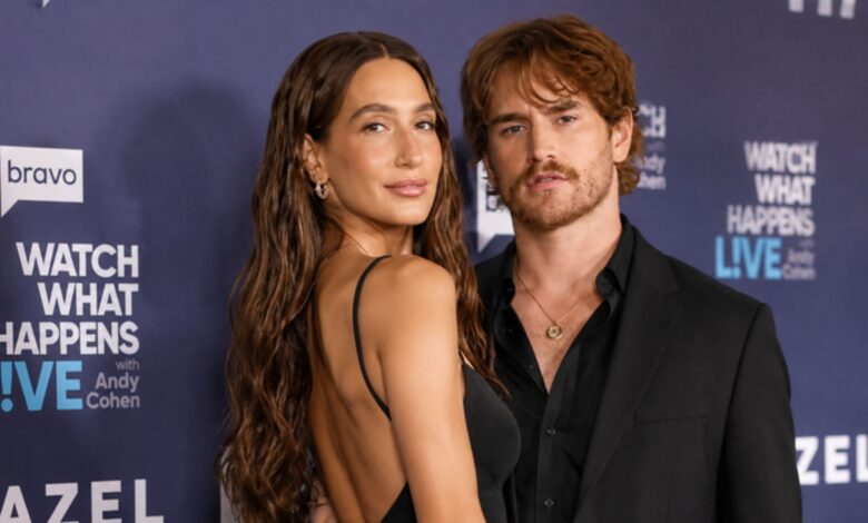 Amanda Batula and West Wilson posing together at a red carpet event