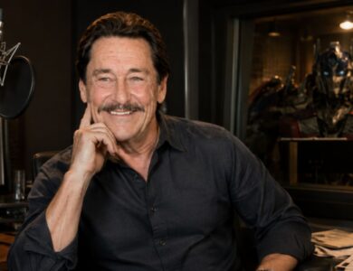Clay Cullen, son of Peter Cullen, pictured in a cinematic recording studio setting
