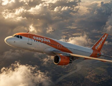 EasyJet Airbus aircraft flying through dramatic clouds on the Lyon to Porto route