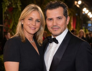 Justine Maurer and John Leguizamo at a public red-carpet appearance.