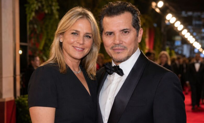 Justine Maurer and John Leguizamo at a public red-carpet appearance.