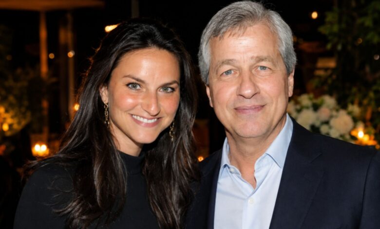 Laura Dimon and Jamie Dimon posing together at an indoor event