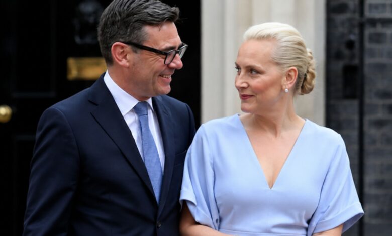 Marie-France van Heel standing beside Andy Burnham outside a London government building