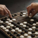 Two players making strategic final moves on a nearly completed grid game board