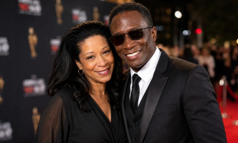 Mitzie Lau and Michael Wright smiling together at a red carpet event