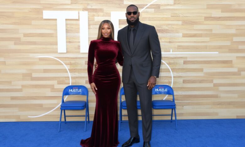 Savannah James and LeBron James posing together at a Space Jam event