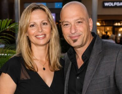 Terry Mandel and Howie Mandel smiling together at an entertainment event