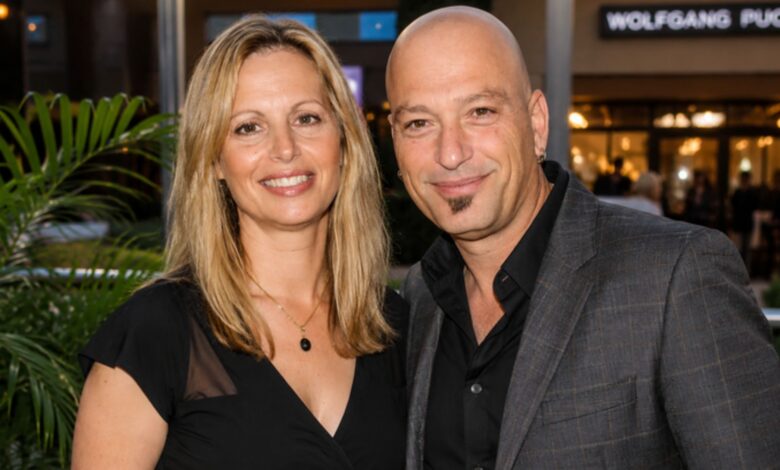Terry Mandel and Howie Mandel smiling together at an entertainment event