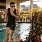 Trideltathon athlete emerging from an indoor pool during a University of Tennessee charity triathlon in Knoxville