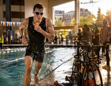 Trideltathon athlete emerging from an indoor pool during a University of Tennessee charity triathlon in Knoxville